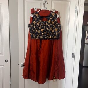 Orange Lehenga with Navy and Gold Embroidered Choli